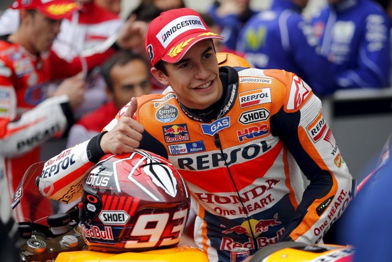 Honda MotoGP rider Marc Marquez of Spain celebrates his pole position after the qualifying session of the French Grand Prix at the Le Mans circuit, in Le Mans, France May 16, 2015. REUTERS/Stephane Mahe 