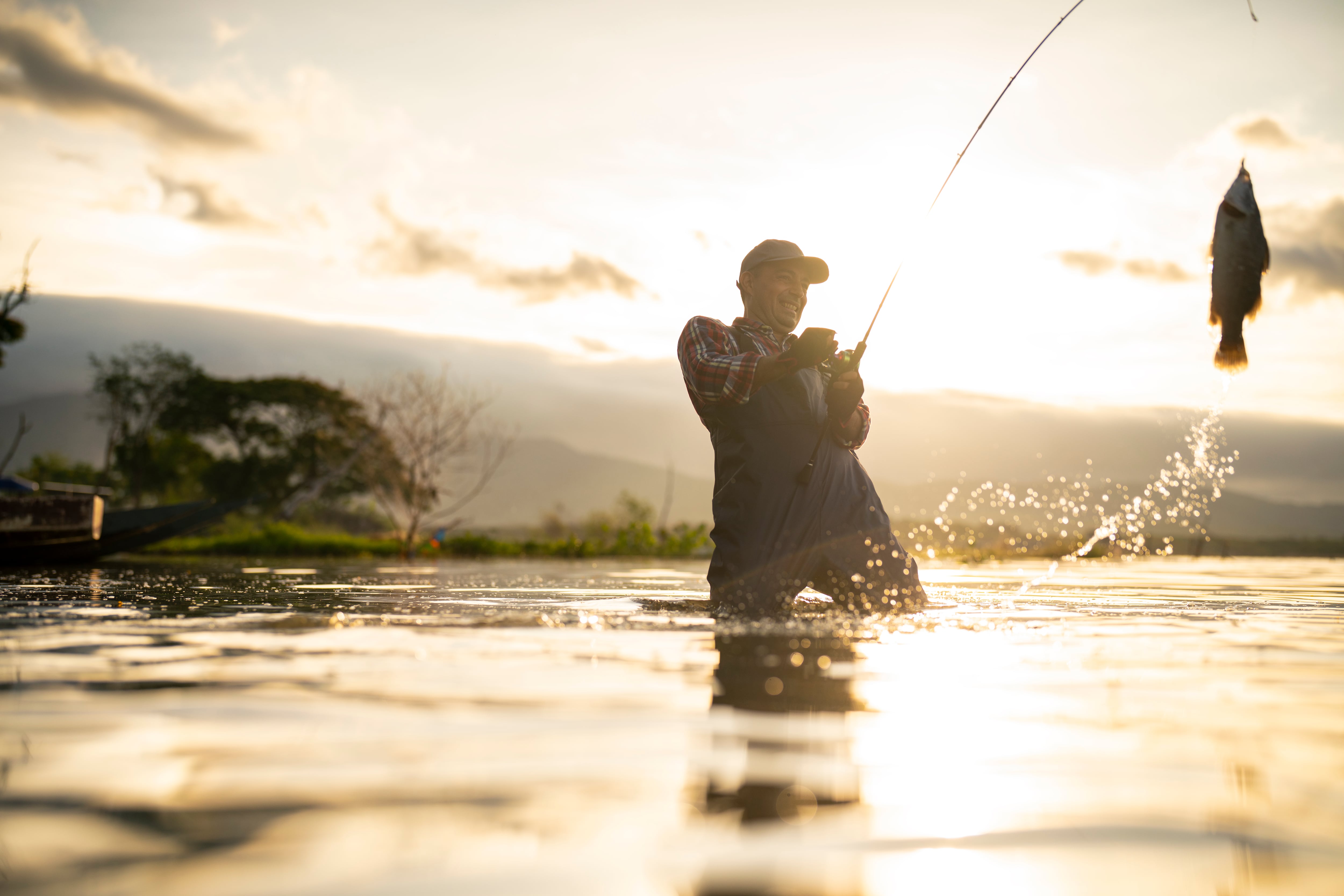 fishing rod lake fisherman men sport summer lure sunset