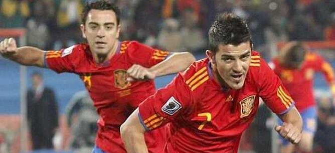 Villa y Xavi durante un partido de La Roja