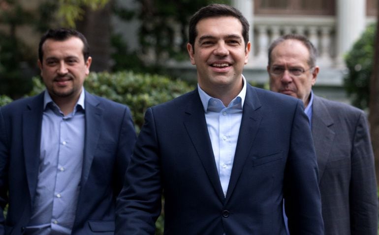 ATHENS, GREECE - JANUARY 26:  Syriza party leader Alexis Tsipras (C) leaves after being sworn in by Greek President Karolos Papoulias as Greece&#039;s new Prime Minister at the Presidential Palace on January 26, 2015 in Athens, Greece. Alexis Tsipras was sworn