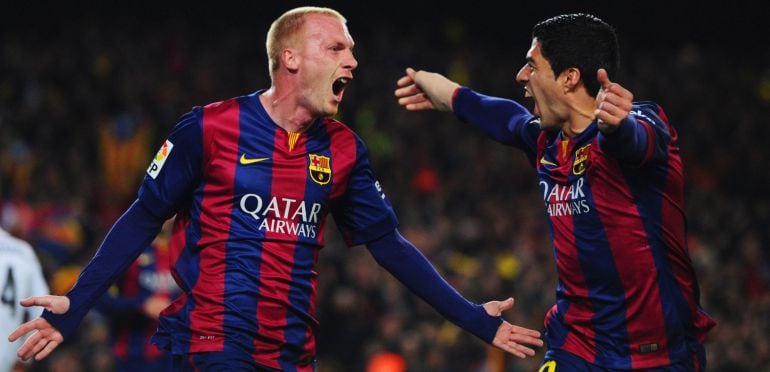 Jeremy Mathieu y Luis Suárez, los autores de los goles del Barcelona en el Clásico.