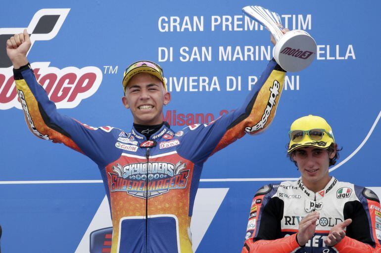 Moto 3 Gresini Racing Team rider Enea Bastianini (L) celebrates on podium after the San Marino Grand Prix in Misano Adriatico circuit in central Italy September 13, 2015.   REUTERS/Max Rossi   