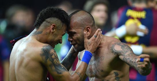 TOPSHOTS  Barcelona's Brazilian forward Neymar da Silva Santos Junior (L) celebrates after the UEFA Champions League Final football match between Juventus and FC Barcelona at the Olympic Stadium in Berlin on June 6, 2015. FC Barcelona won the match 1-3. A