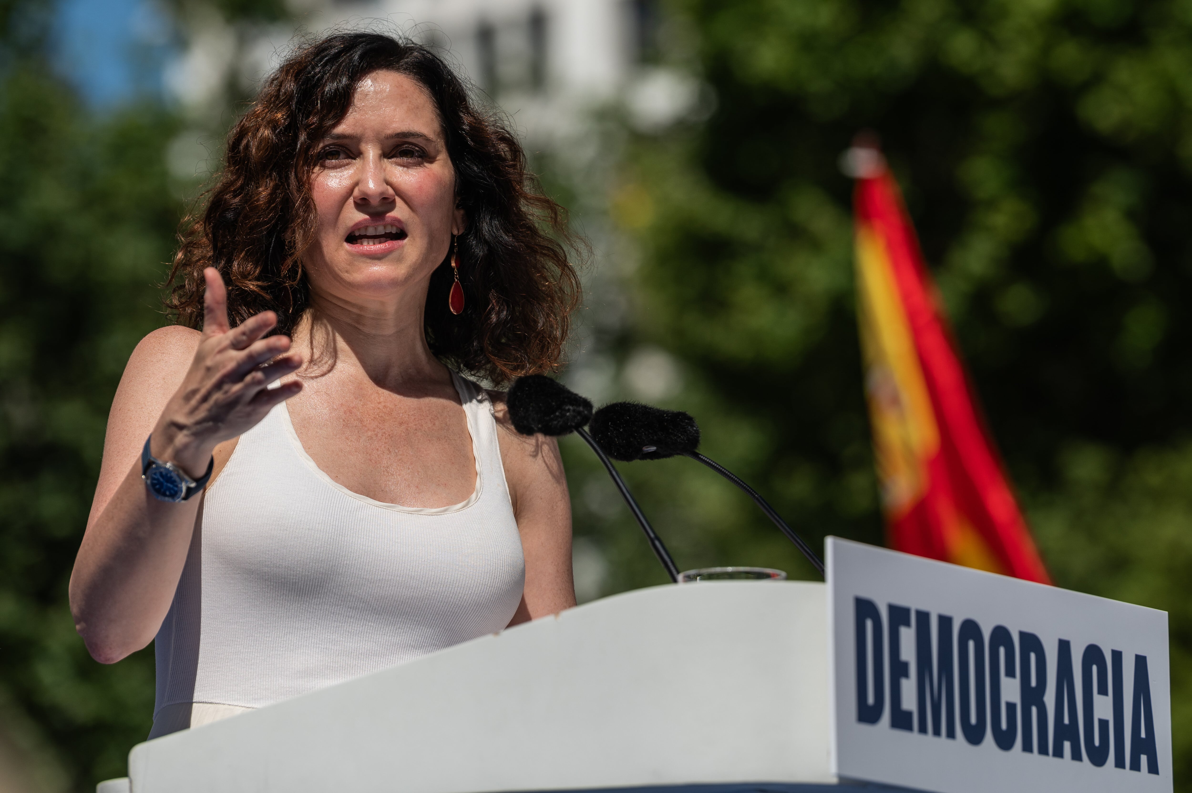 MADRID, SPAIN - 2025/06/08: People's Party (PP) President of the Community of Madrid Isabel Diaz Ayuso speaks during a demonstration called by the opposition party. Thousands of people have gathered in Plaza de España square to protest against the Government under the slogan "Mafia or democracy" demanding the resignation of Prime Minister Pedro Sanchez. (Photo by Marcos del Mazo/LightRocket via Getty Images)