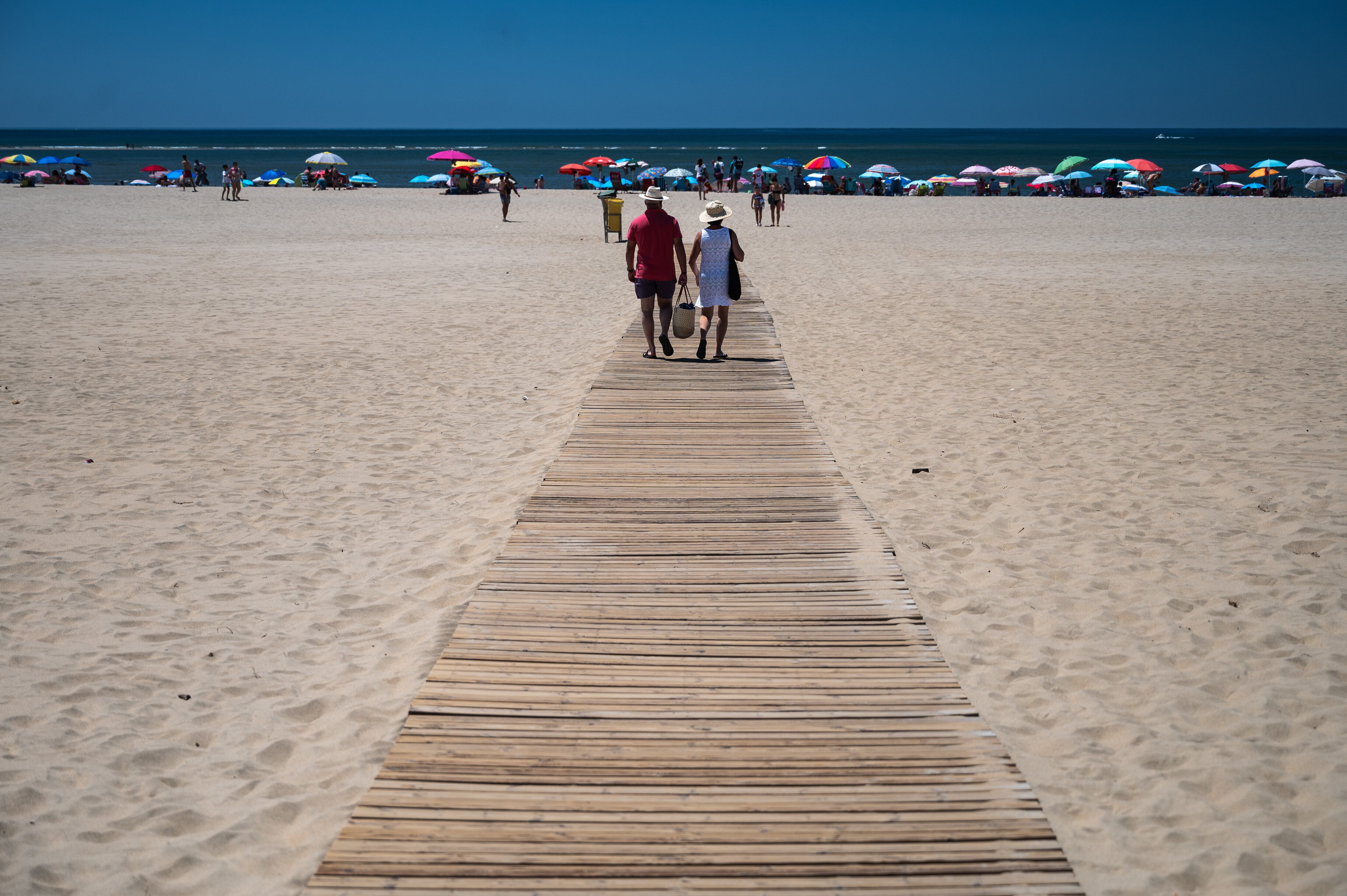 ISLA CANELA, HUELVA, SPAIN - 2024/06/23: Tourists heading to the beach at Isla Canela Beach. Isla Canela is a tourist vacation destination located south of the town of Ayamonte, Huelva, in Andalusia, south west of Spain on the border with Portugal. (Photo by Marcos del Mazo/LightRocket via Getty Images)