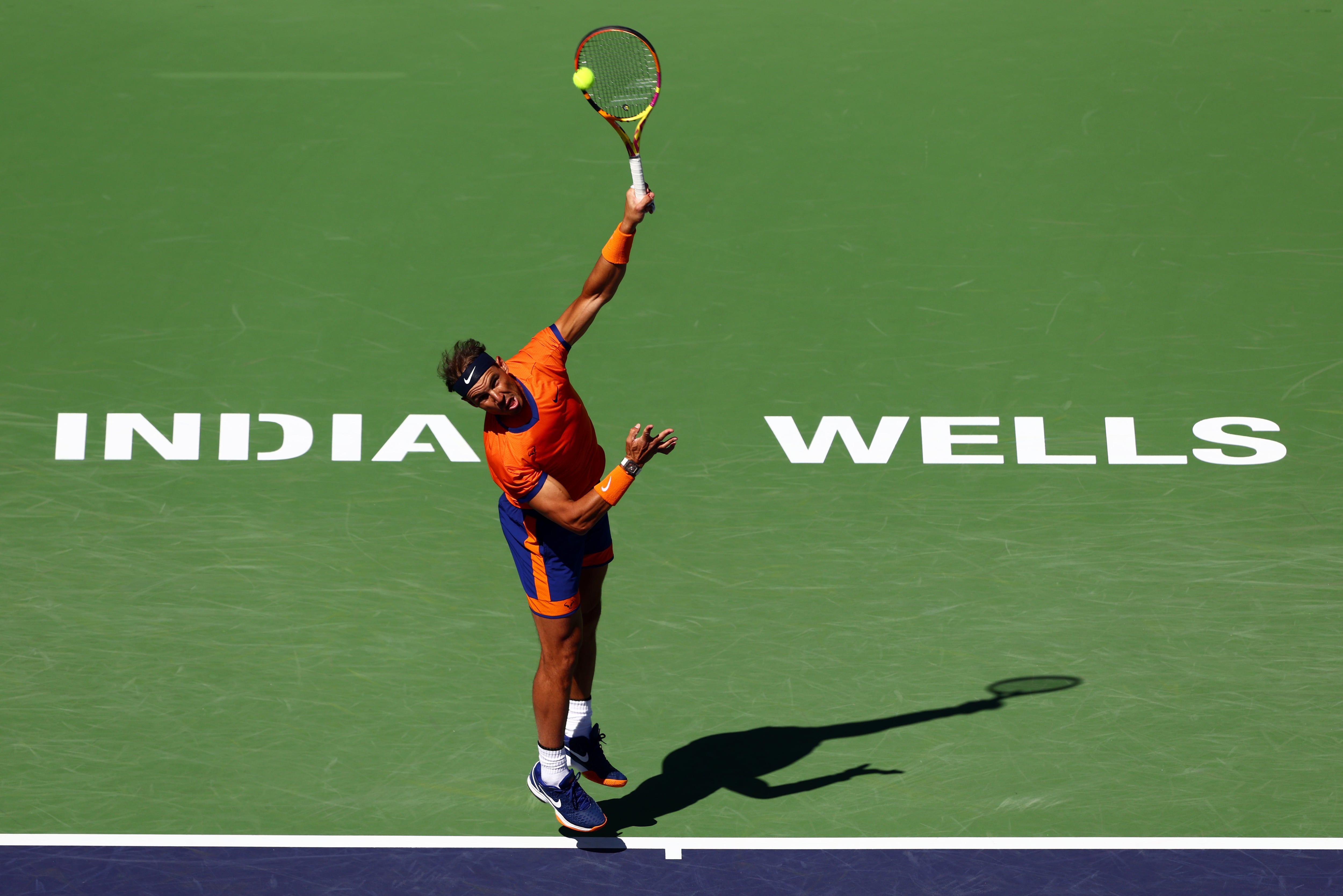 INDIAN WELLS, CALIFORNIA - MARCH 12: Rafael Nadal of Spain serves against Sebastian Korda of the United States in their second round match on Day 6 of the BNP Paribas Open at the Indian Wells Tennis Garden on March 12, 2022 in Indian Wells, California. (Photo by Clive Brunskill/Getty Images)