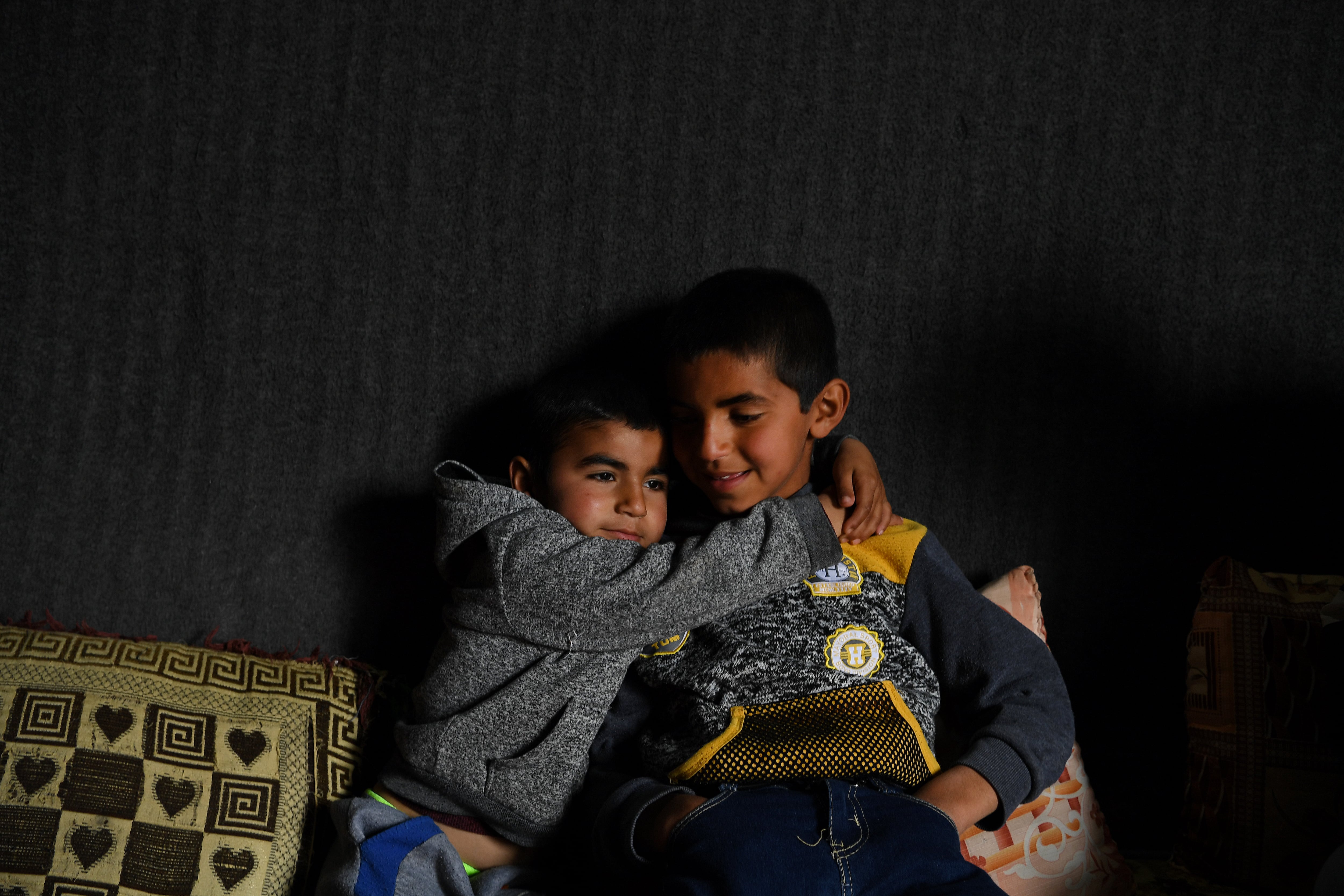 Yazidi brothers, Anas Azad, 4, and Ayham Azad, 9, live with their uncle in Sharya village in Dohuk Governate, Iraqi Kurdistan, March 26, 2019. Both boys were kidnapped and held captive by IS fighters. Ayham was captured in 2014 and sold several times before he was bought by the American wife of an IS figher who treated him like her own son. He was realised in 2017. (Photo by Kate Geraghty/Fairfax Media via Getty Images via Getty Images)