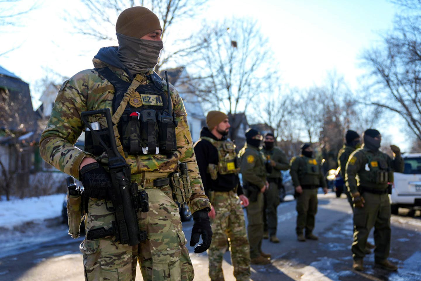 ICE agents gather near 31st Avenue N. and 3rd Street on Jan. 14 in Minneapolis. (Alex Kormann/The Minnesota Star Tribune/TNS)