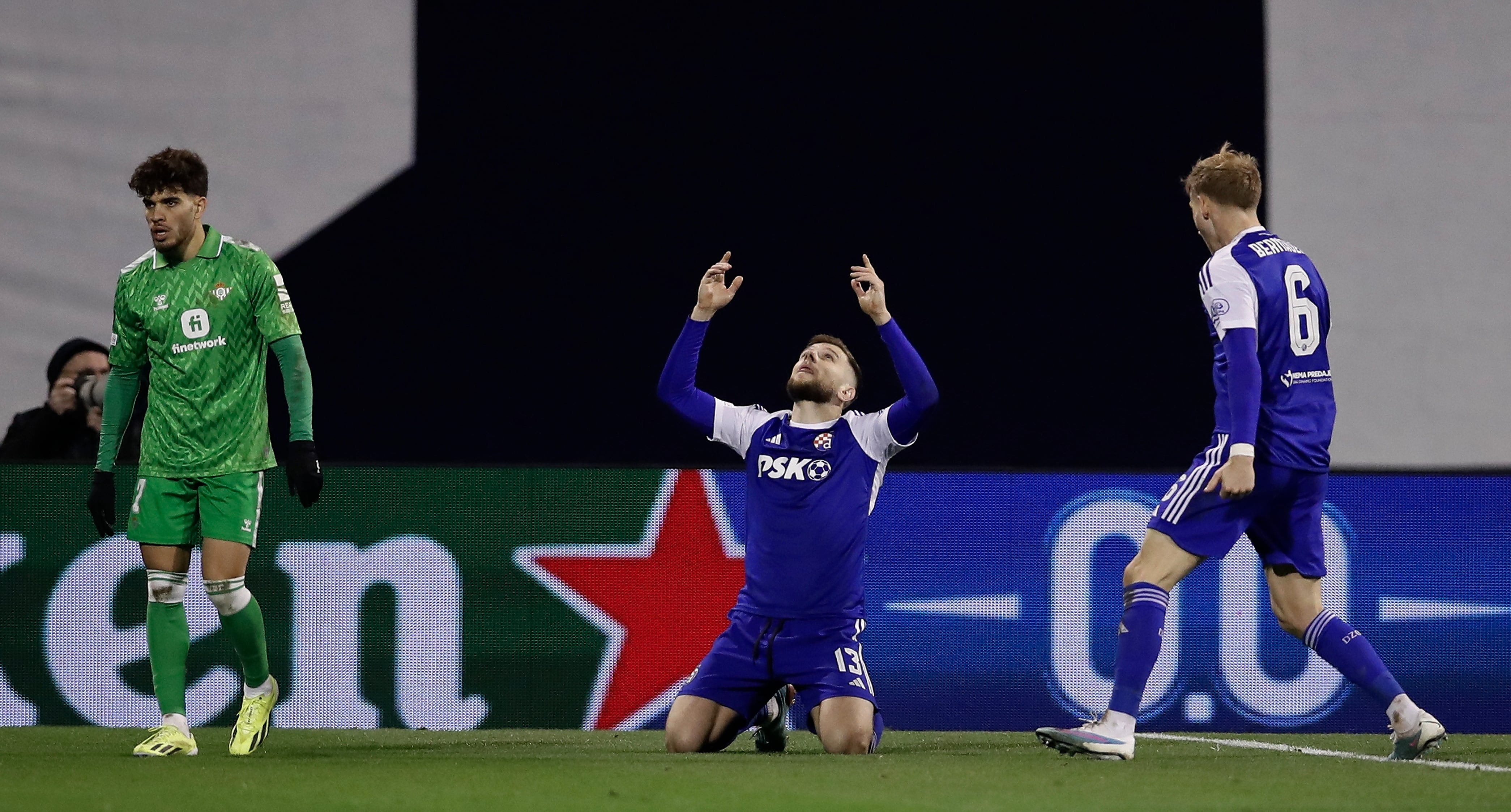 Zagreb (Croatia), 22/02/2024.- Dinamo's Stefan Ristovski (C) and teammate Maxime Bernauer (R) react at the end of the UEFA Europa Conference League knock-out round play-offs, 2nd leg soccer match between Dinamo Zagreb and Real Betis in Zagreb, Croatia, 22 February 2024. (Croacia) EFE/EPA/ANTONIO BAT