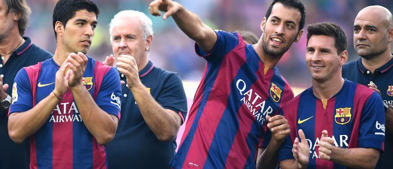 Sergio Busquets, junto a Leo Messi en la presentación del equipo de esta temporada 2014-15.