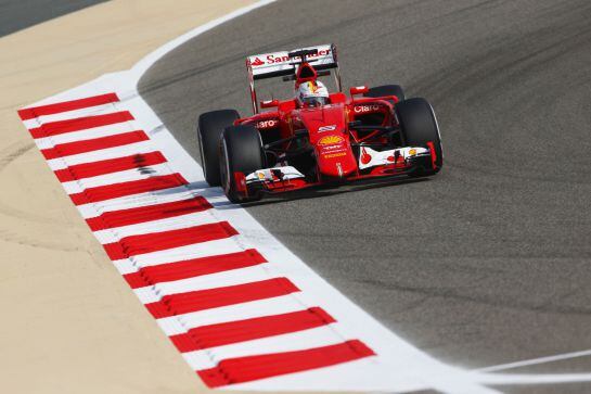 BAHRAIN, BAHRAIN - APRIL 17: Sebastian Vettel of Germany and Ferrari drives during practice for the Bahrain Formula One Grand Prix at Bahrain International Circuit on April 17, 2015 in Bahrain, Bahrain. (Photo by Clive Mason/Getty Images)