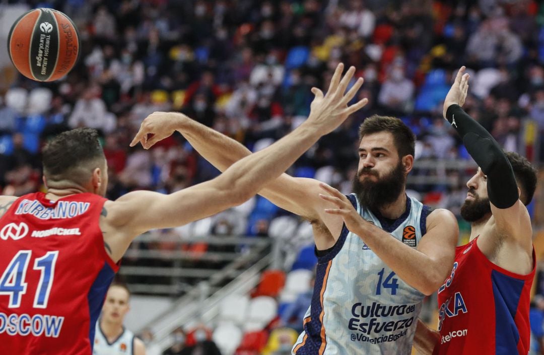 Nikita Kurbanov and Tornike Shengelia of CSKA Moscow in action against Bojan Dubljevic of Valencia Basket during the Euroleague basketball match between CSKA Moscow and Valencia Basket in Moscow