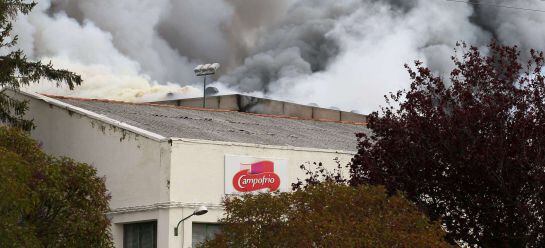 Smoke billows from the Campofrio meat factory, in the city of Burgos on November 16, 2014. The fire, thought to have been caused by a short circuit, started around 7am this morning. Although damages are extensive, no employees were reported injured. AFP P