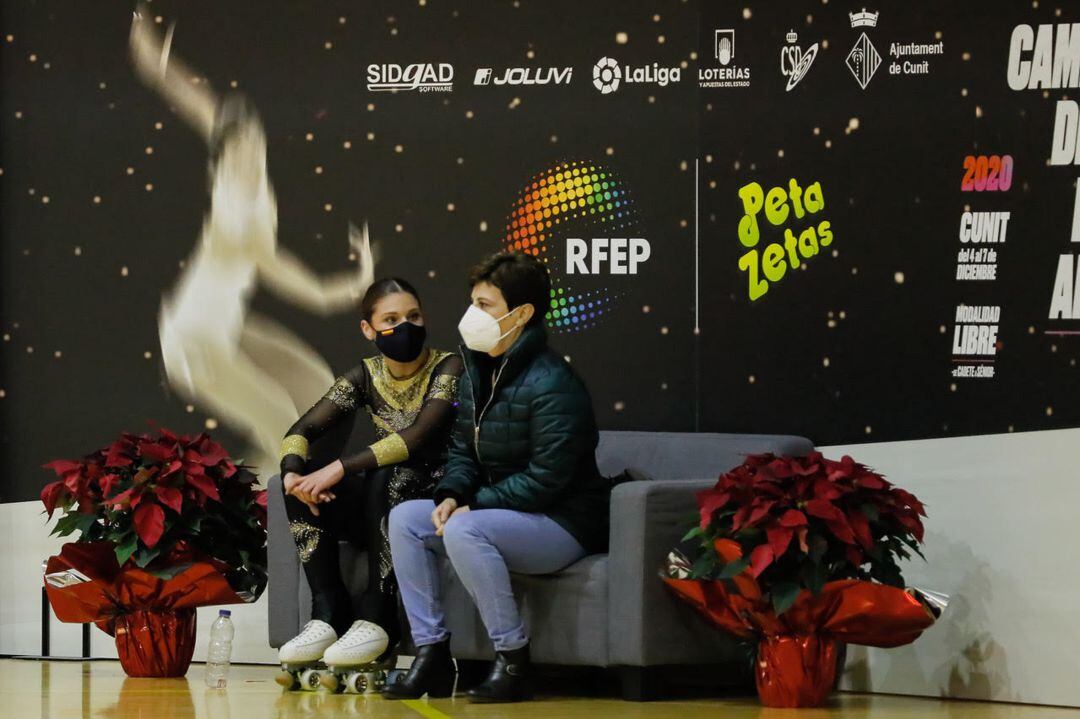 Raquel Pla y su entrenadora