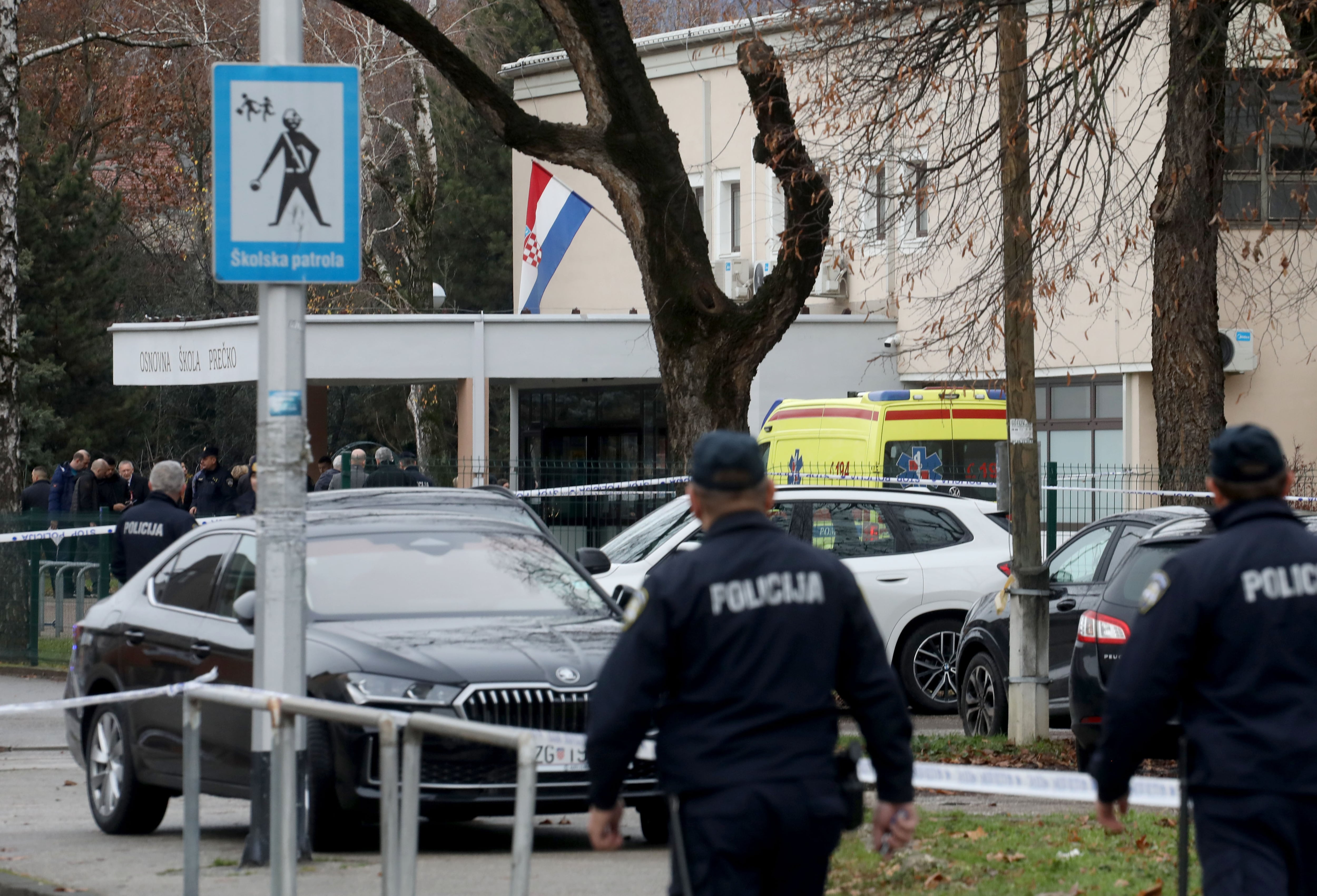 ZAGREB, CROATIA - DECEMBER 20: Croatian police officers conduct investigation at the site after a knife attack at the Precko Primary School in Zagreb, Croatia on December 20, 2024. It is reported that 1 student died, 1 teacher and 5 students were injured. In a statement made by Zagreb Police, identity of the attacker has not yet been determined. (Photo by Stipe Majic/Anadolu via Getty Images)