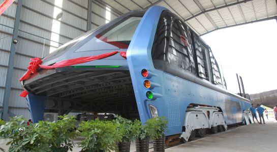 A model of an innovative street-straddling bus called Transit Elevated Bus is seen after a test run in Qinhuangdao, Hebei Province, China, August 3, 2016. The test bus currently consists of one segment, and is capable of carrying 300 people, according to 