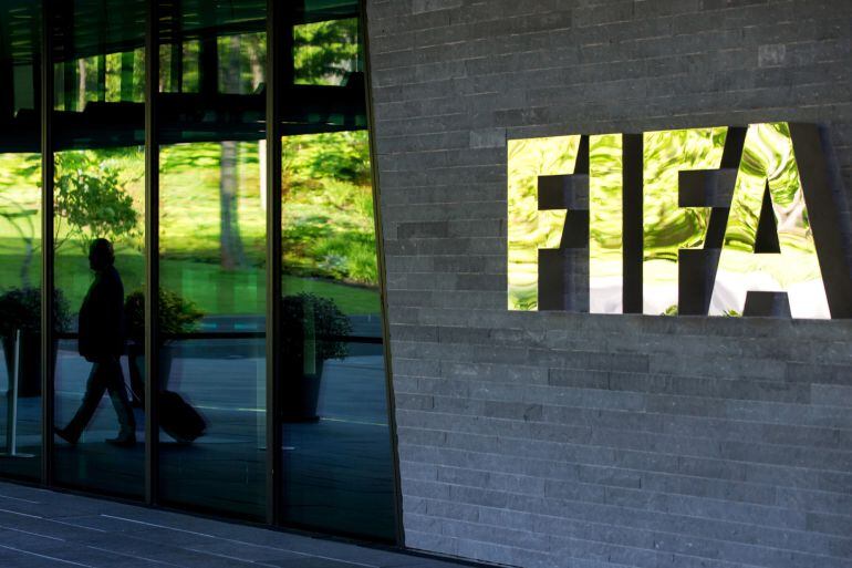 ZURICH, SWITZERLAND - JUNE 03: A FIFA logo sits next to the entrance at the FIFA headquarters on June 3, 2015 in Zurich, Switzerland. Joseph S. Blatter resigned as president of FIFA. The 79-year-old Swiss official, FIFA president for 17 years said a speci