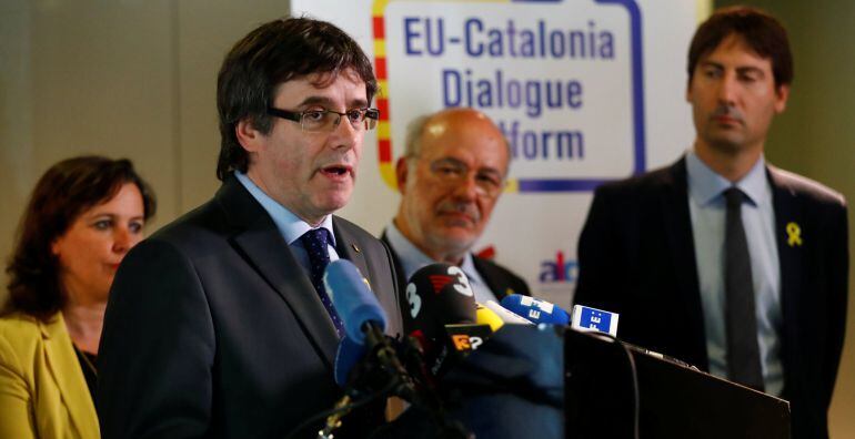 Former Catalan president Carles Puigdemont and members of the EU Catalonia dialogue platform address a news conference in Berlin