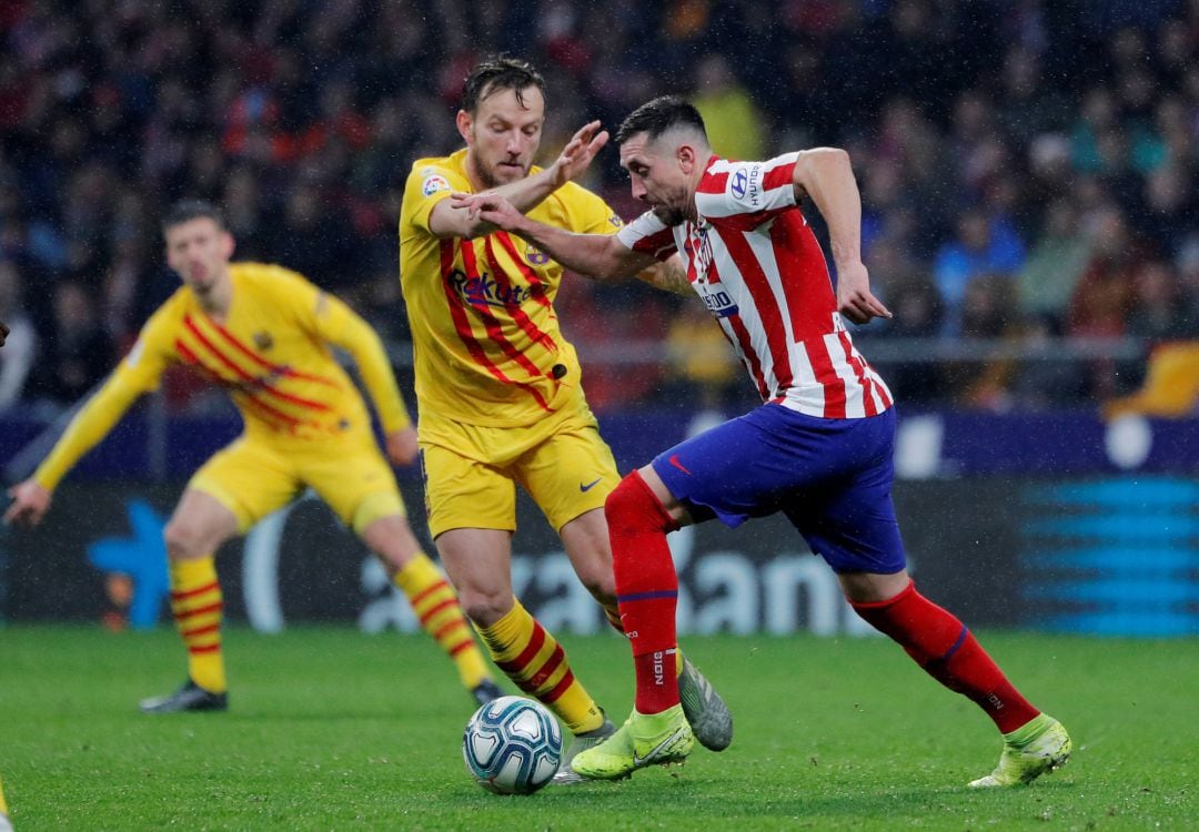 Rakitic y Herrera, en el último Atlético - Barcelona.