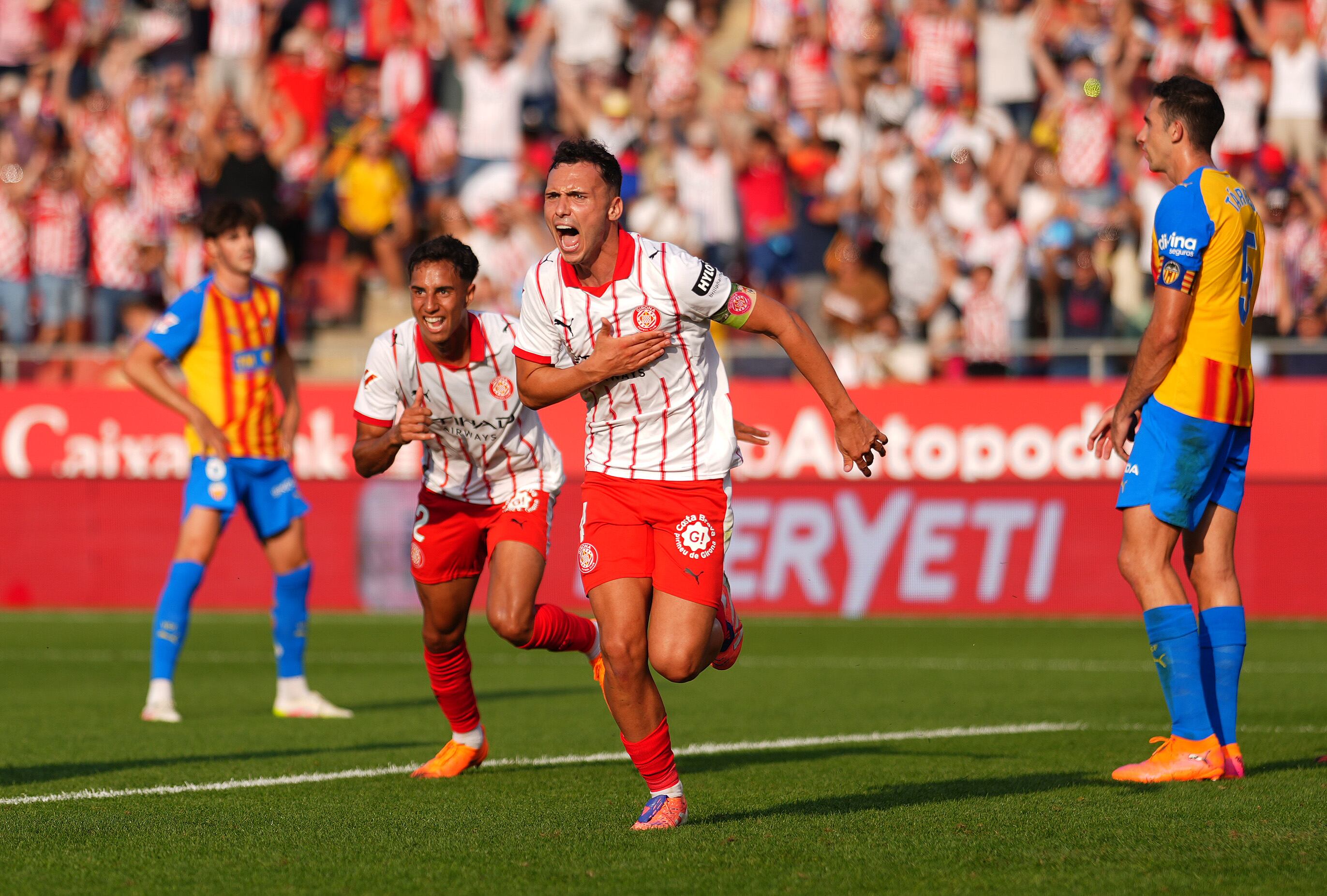 GIRONA, SPAIN - OCTOBER 04: Arnau Martinez of Girona celebrates scoring his team's second goal during the LaLiga EA Sports match between Girona FC and Valencia CF at Montilivi Stadium on October 04, 2025 in Girona, Spain. (Photo by Alex Caparros/Getty Images)