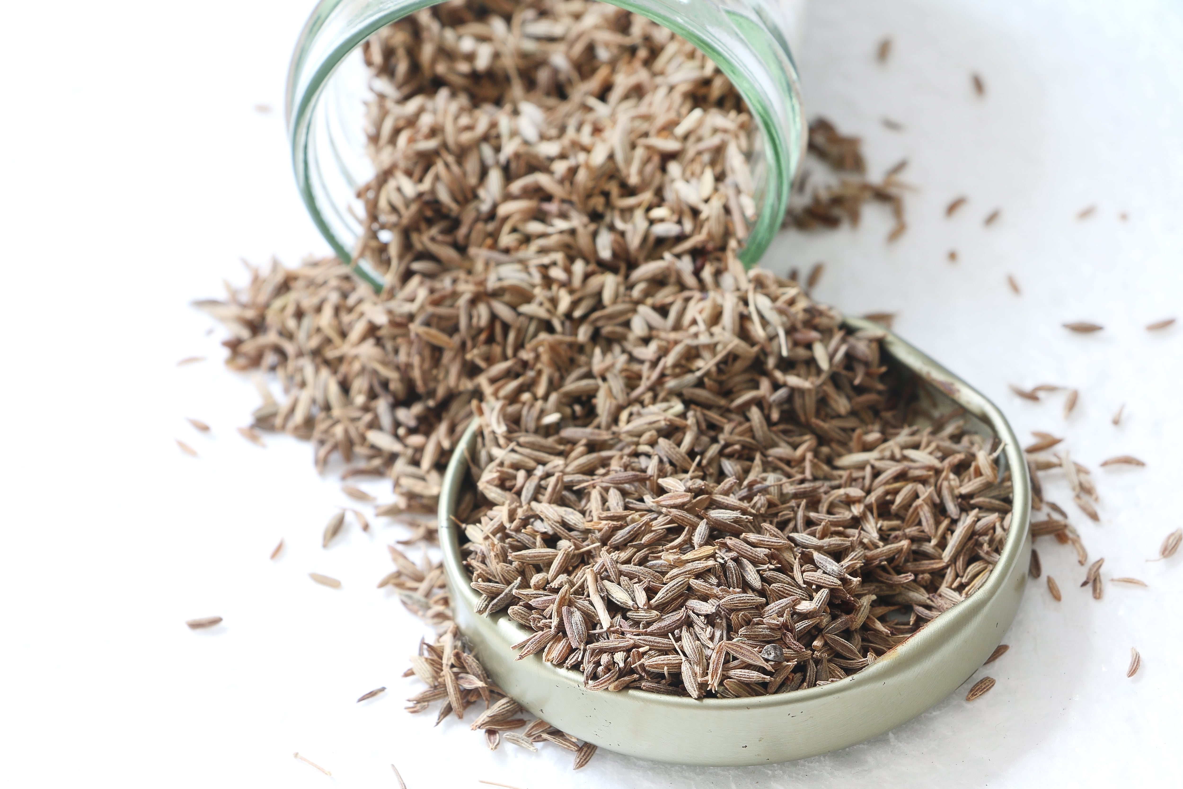 Cumin seeds herb on white isolated background