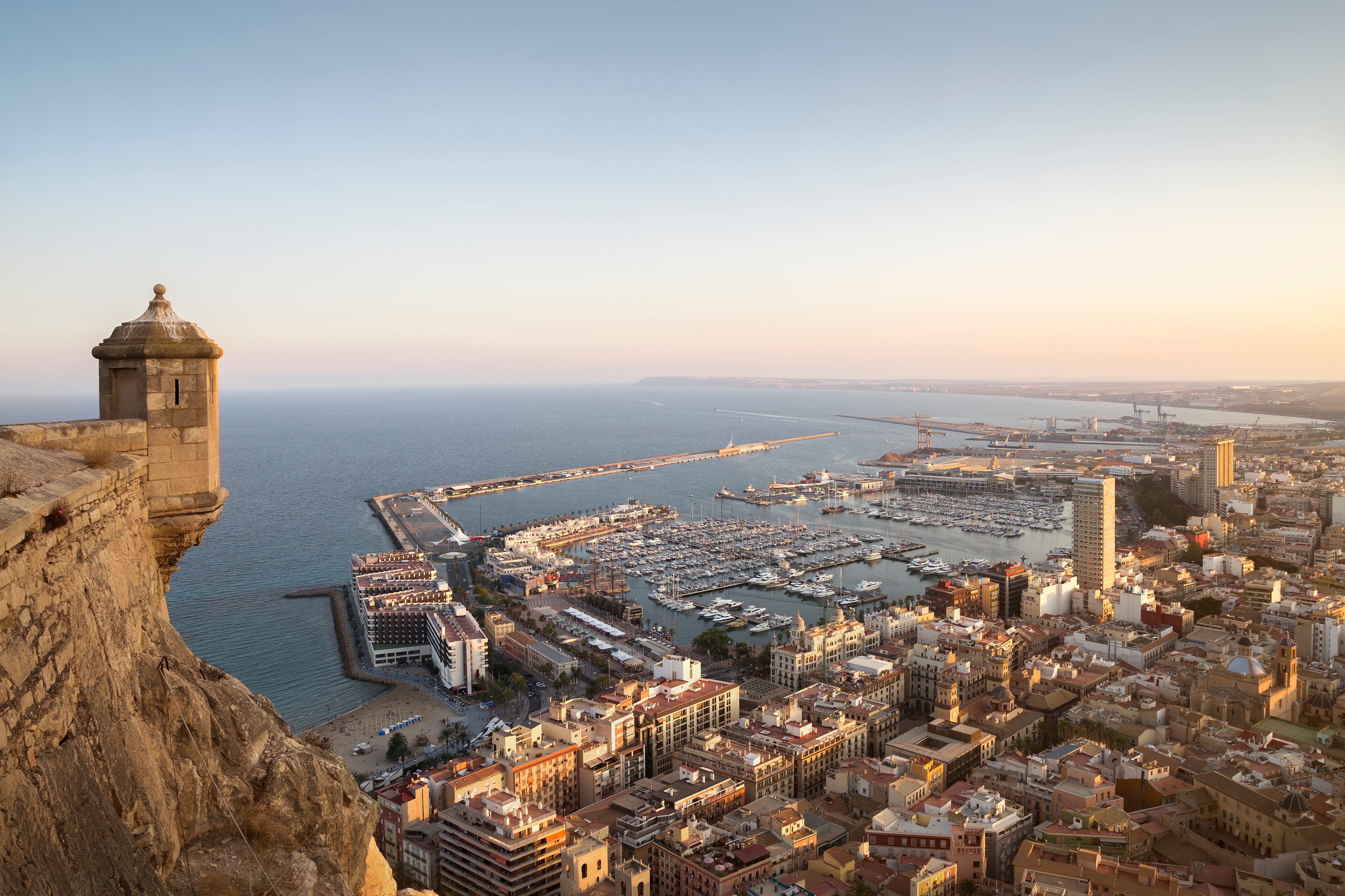 View of the marina and city center of alicante at sunset.