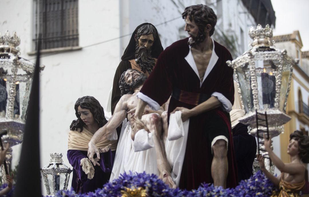 La Hermandad de Santa Marta de Sevilla a su paso por la calle Jesús del Gran Poder.