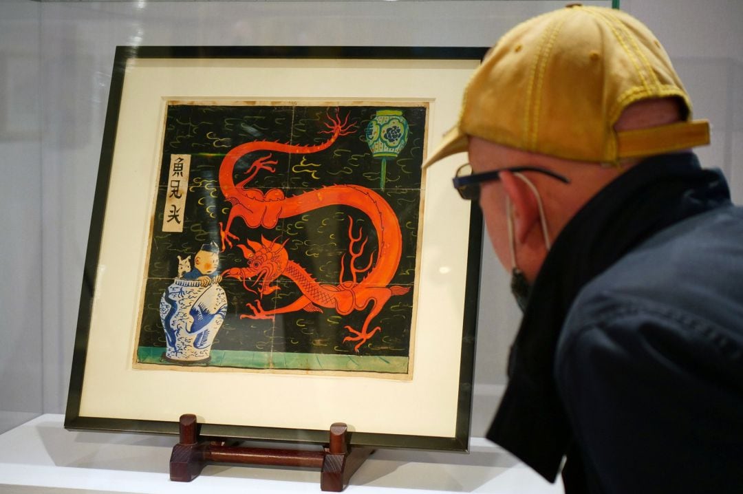 Painting for the original cover of &quot;The Blue Lotus&quot; (Lotus Bleu) Tintin comic book (1936), is displayed before being auctioned by Artcurial in Paris, France January 13, 2021