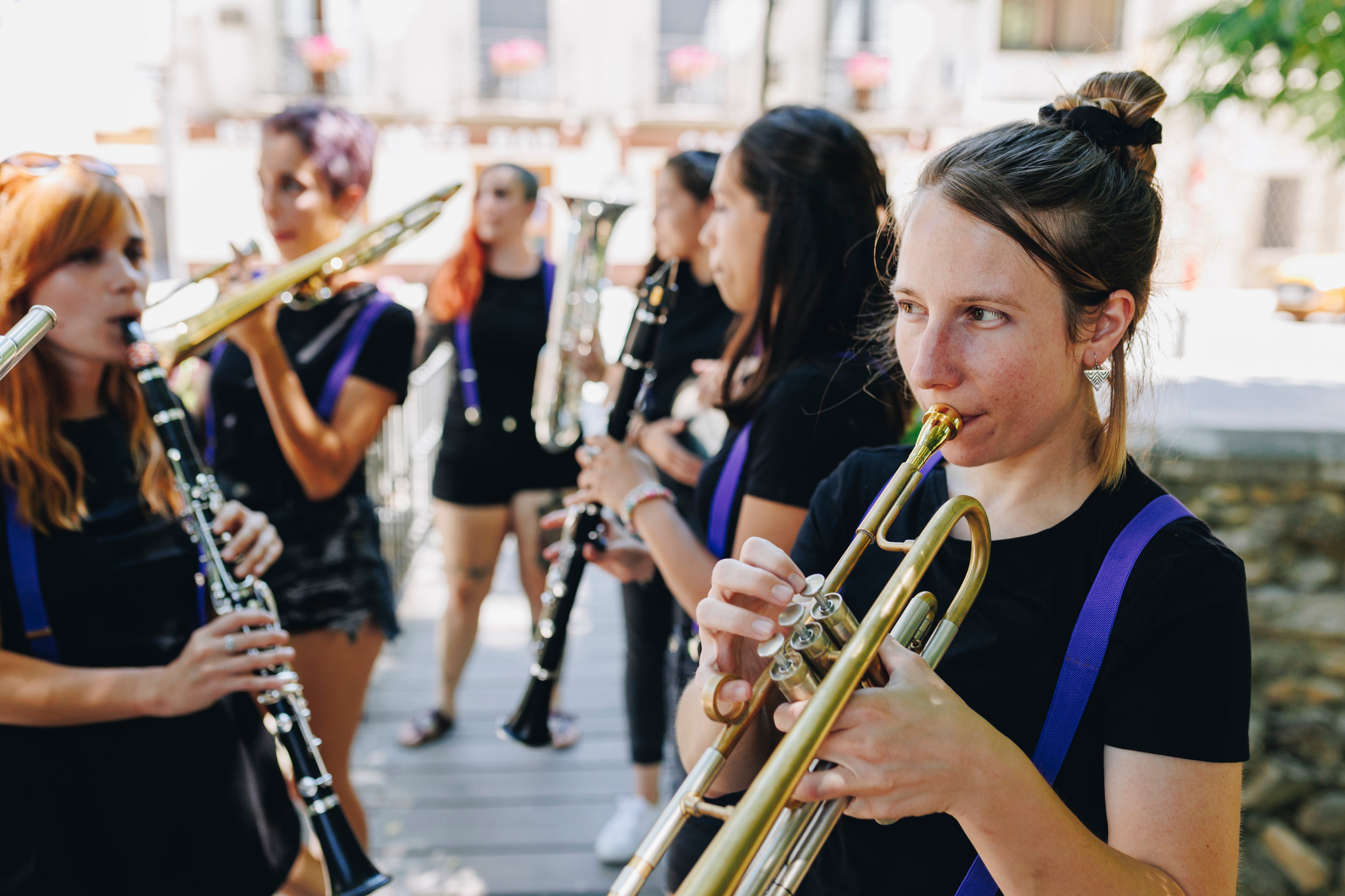 Women&#039;s folk group rehearsing with musical instruments