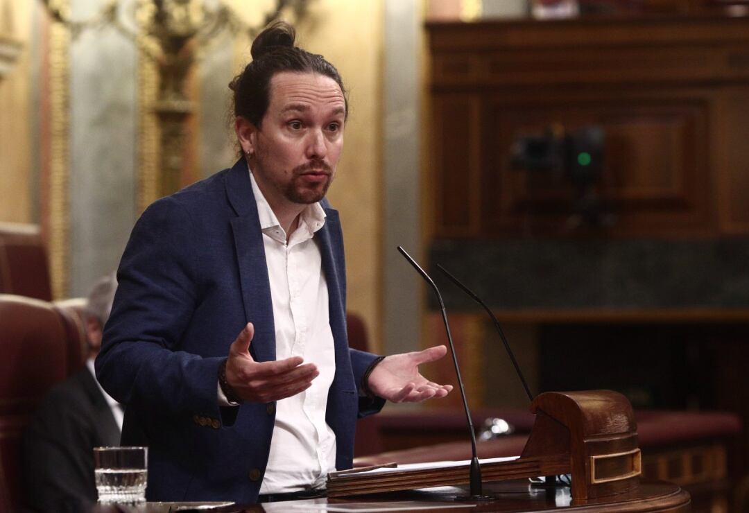 El vicepresidente segundo del Gobierno, Pablo Iglesias, interviene durante una sesión de control al Gobierno en el Congreso de los Diputados, en Madrid (España)