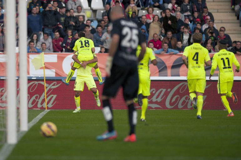 Barcelona's defender Jordi Alba (L Top) celebrates after scoring with his teammates during the Spanish league football match UD Almeria vs FC Barcelona on November 8, 2014 at Juegos Mediterraneos stadium in Almeria. AFP PHOTO/ JORGE GUERRERO