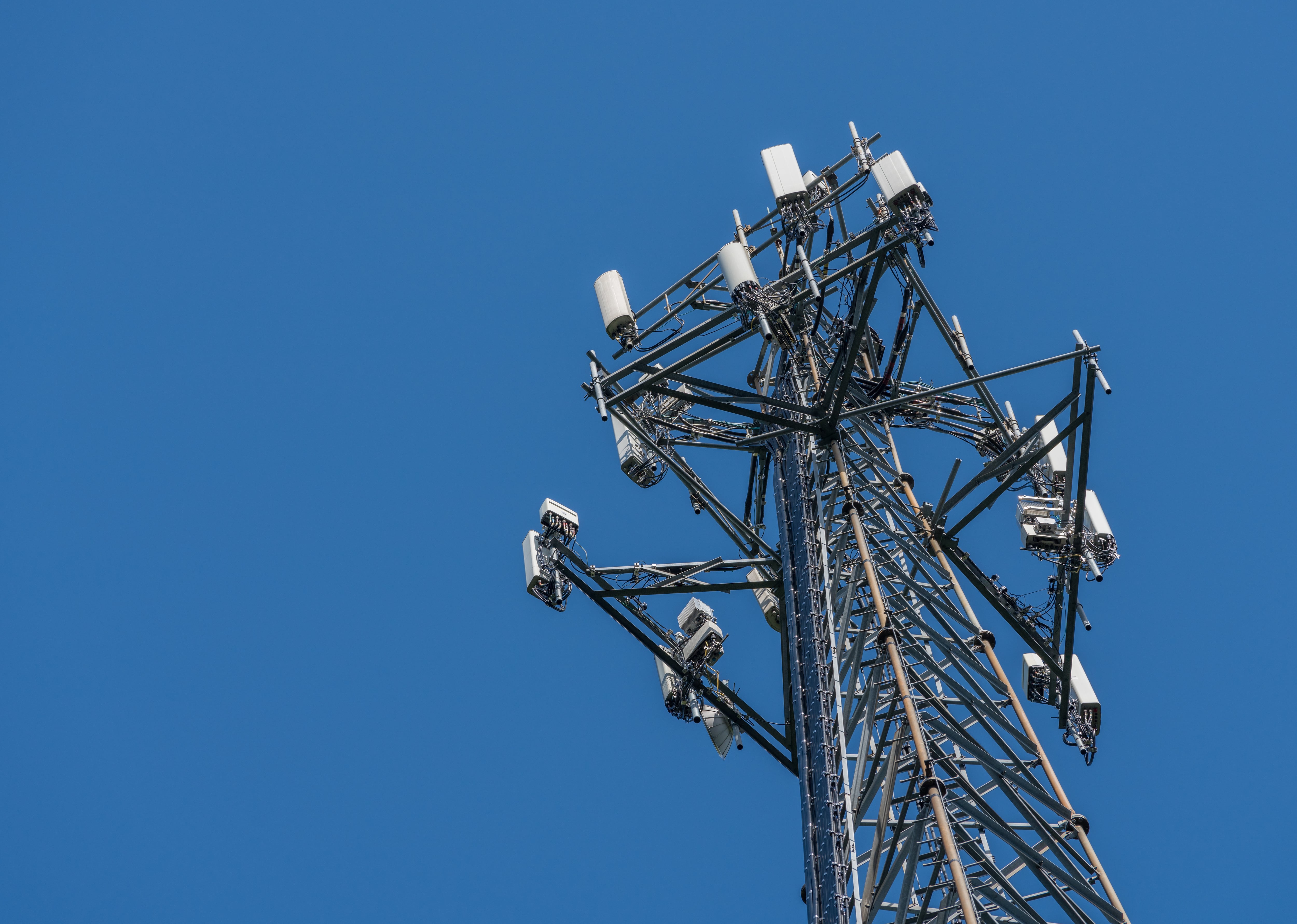 Aerial view of mobile phone cell tower to illustrate lack of broadband internet service in rural areas and need for investment