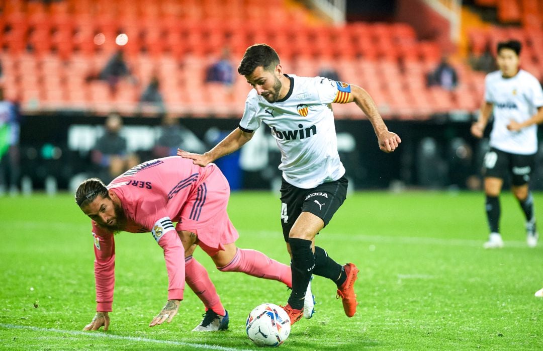 Jose Luis Gaya of Valencia CF and Sergio Ramos of Real Madrid during the La Liga Santander mach between Valencia and Real Madrid at Estadio de Mestalla on November 8, 2020 in Valencia, Spain AFP7 
  ONLY FOR USE IN SPAIN