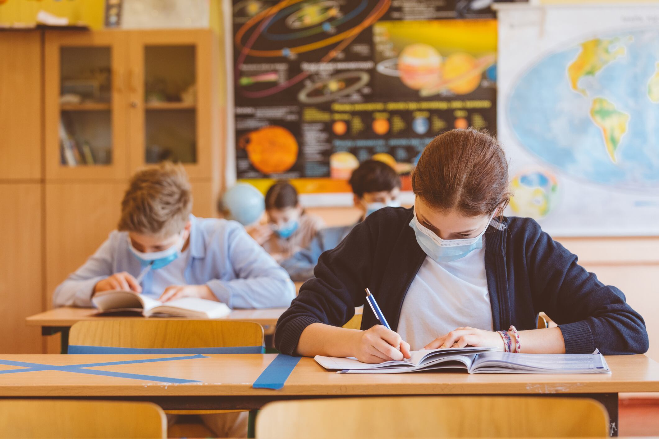 High school students at school, wearing N95 Face masks.Sitting in a classroom.