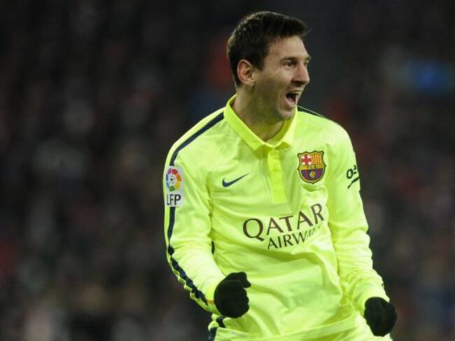 Barcelona's Argentinian forward Lionel Messi celebrates after scoring during the Spanish league football match Athletic Club Bilbao vs FC Barcelona at the San Mames stadium in Bilbao on February 8, 2015. Barcelona won 5-2. AFP PHOTO/ ANDER GILLENEA