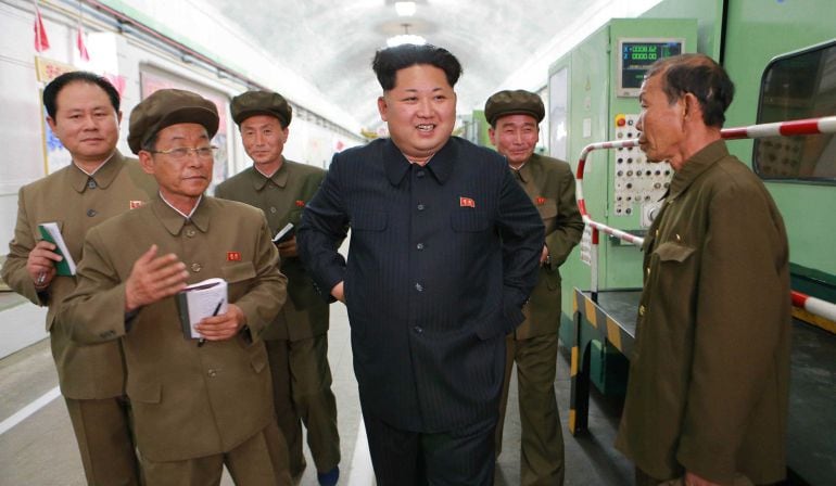 This undated picture released from North Korea&#039;s official Korean Central News Agency (KCNA) on May 7, 2015 shows North Korean leader Kim Jong-Un (C) inspecting the February 11 plant of the Ryongsong machine complex in South Hamgyong province.  AFP PHOTO /