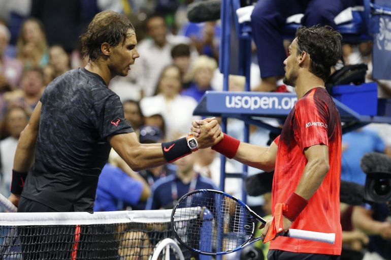 Sep 4, 2015; New York, NY, USA; Fabio Fognini of Italy (R) shakes hands with Rafael Nadal of Spain (L) on day five of the 2015 U.S. Open tennis tournament at USTA Billie Jean King National Tennis Center. Fognini won 3-6, 4-6, 6-4, 6-3, 6-4. Mandatory Credit: Geoff Burke-USA TODAY Sports