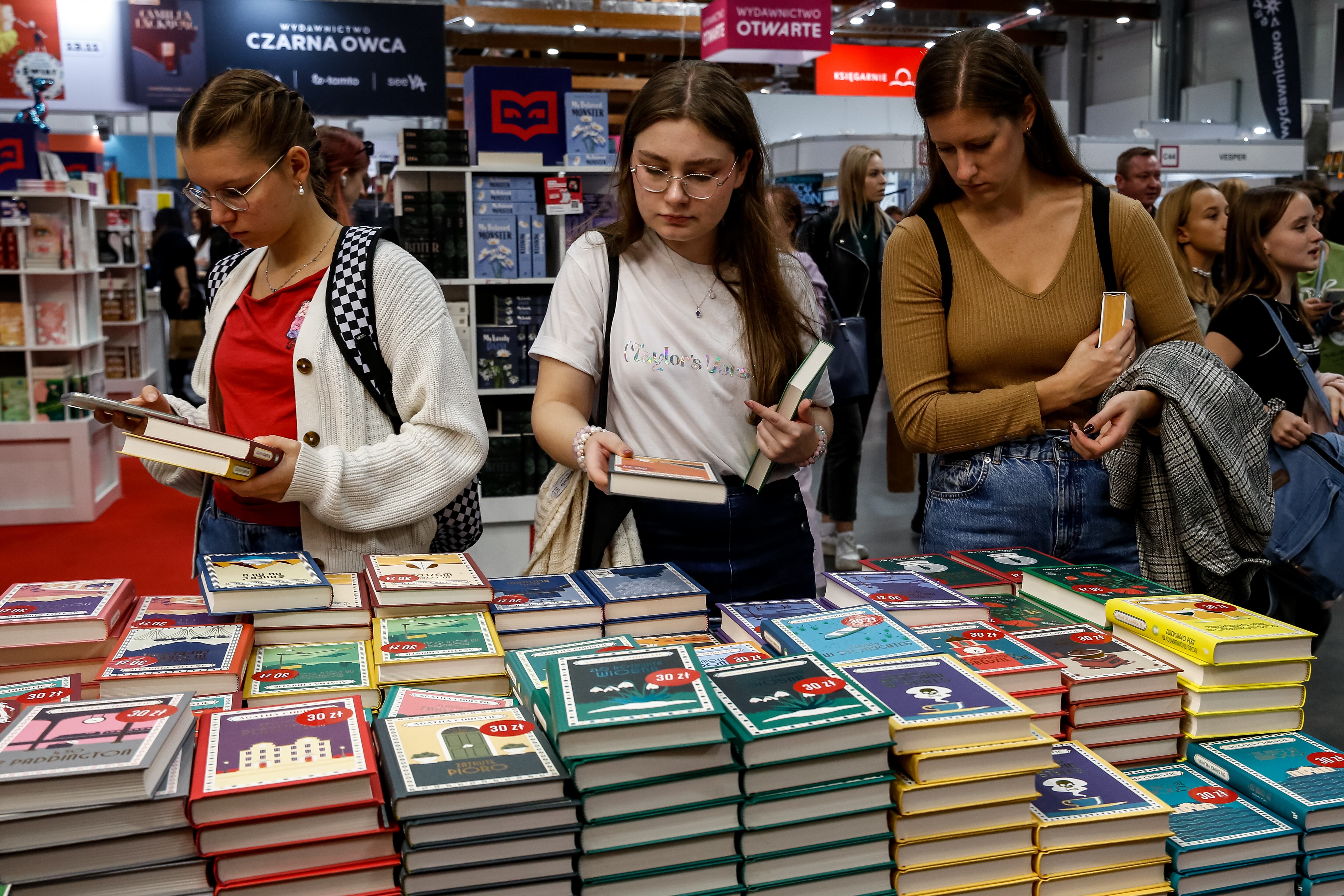 Participants browse on a book stand during the 27.