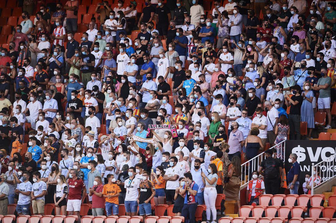 Fans cheer up on their return to the stadium during the pre-season friendly match and Trofeo Taronja between Valencia CF and AC Milan at Estadi de Mestalla 