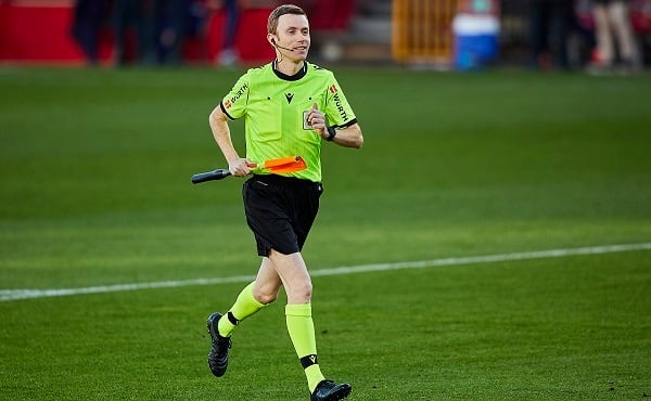 GRANADA, SPAIN - DECEMBER 30: Referee assistant Antonio Luis Cerezo Parfenof runs to check the goal nets before the La Liga Santander match between Granada CF and Valencia CF at Estadio Nuevo Los Carmenes on December 30, 2020 in Granada, Spain. Sporting stadiums around Spain remain under strict restrictions due to the Coronavirus Pandemic as Government social distancing laws prohibit fans inside venues resulting in games being played behind closed doors. (Photo by Fermin Rodriguez/Quality Sport Images/Getty Images)