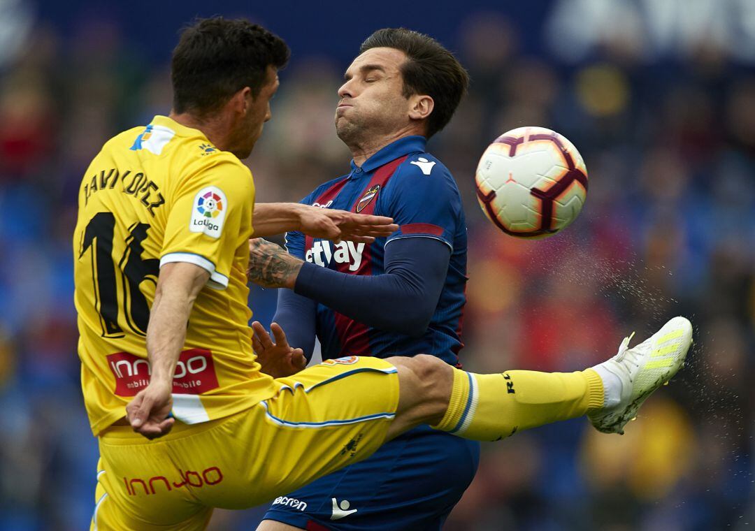 Toño Garcia of Levante competes for the ball with Javi Lopez of Espanyol during the La Liga match between Levante UD and RCD Espanyol 