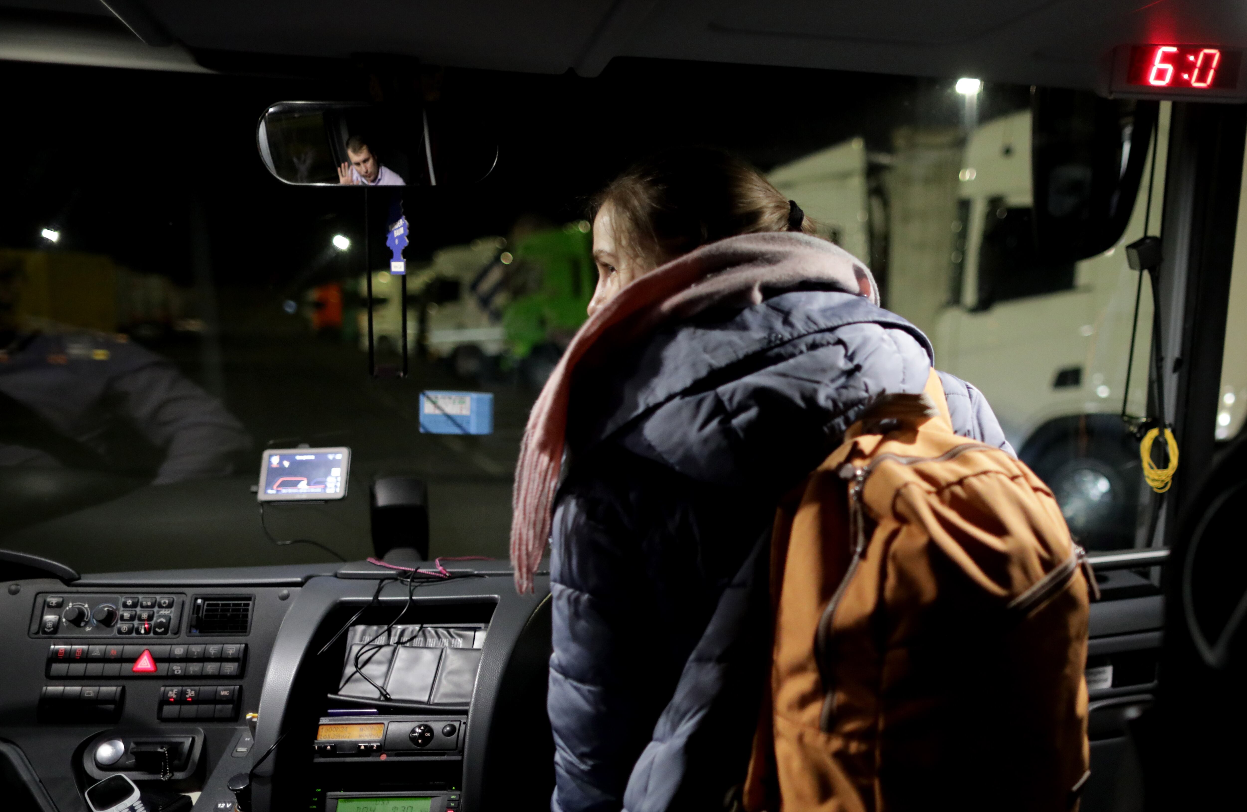 Vienna (Austria), 18/03/2022.- (25/29) Ukrainian refugee Jenia wishes the bus driver a good rest of the trip as h at a gas station outside Vienna, Austria, 18 March 2022. Thirty-year-old Jenia, a psychologist from Kyiv, was enjoying a yoga retreat in the Carpathian mountains when her mother called her on the day Russia invaded. You must not return to Kyiv, now you must leave Ukraine as soon as possible. It is not safe for you to come home to us, her mother had told her. Jenia quickly took charge of communications, talking with the Romanian-speaking bus drivers and explaining to her fellow passengers what documents they will need once they reach the border. Some 73 Ukrainians, women, children, and a few men fled the conflict mostly from the southern Ukraine area, boarded the bus organized by the Be An Angle German NGO, to travel to safety in Germany. After checking that they had travel documents the NGO arranged for them to be taken to various locations in Germany where they would have the temporary asylum status and receive assistance for lodging for a while until the conflict ends or they find a longer-term solution. (Alemania, Moldavia, Rumanía, Rusia, Ucrania, Viena) EFE/EPA/AMEL PAIN ATTENTION: For the full PHOTO ESSAY text please see Advisory Notice epa...
