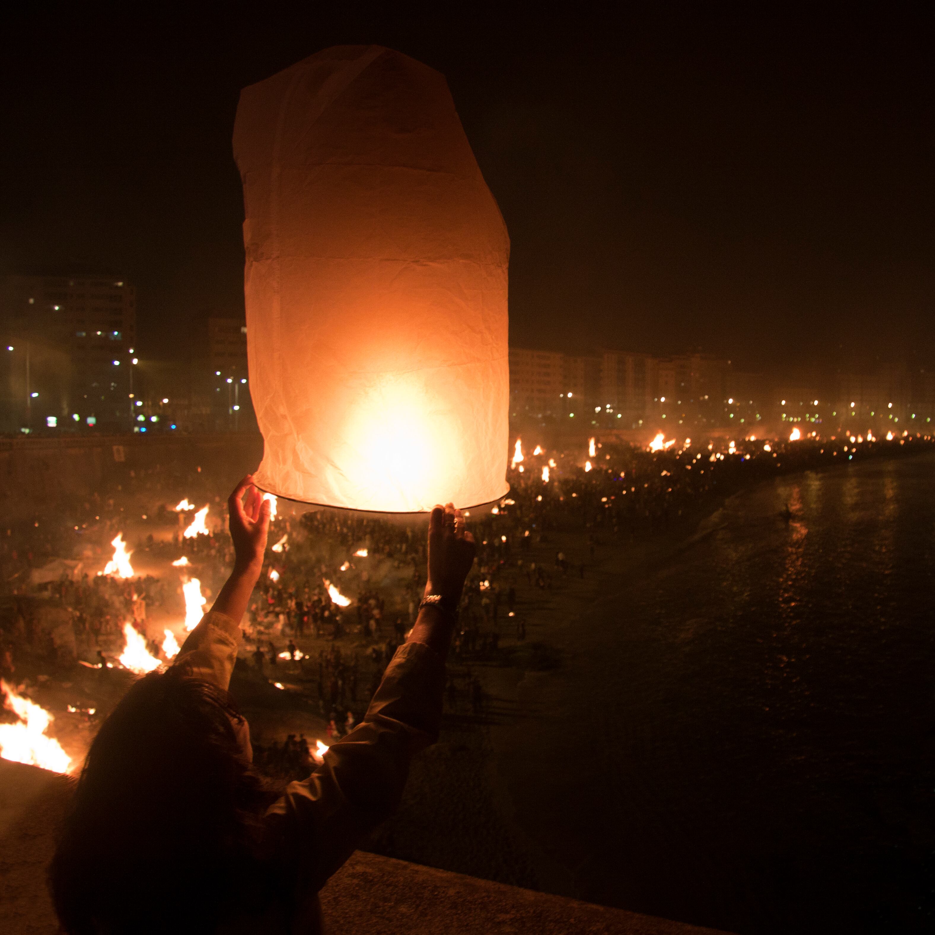 A paper lantern is released in San Juan Eve in A Coruña. Many bonfires, called St. John&#039;s fire, are lighted in Orzan&#039;s beach.