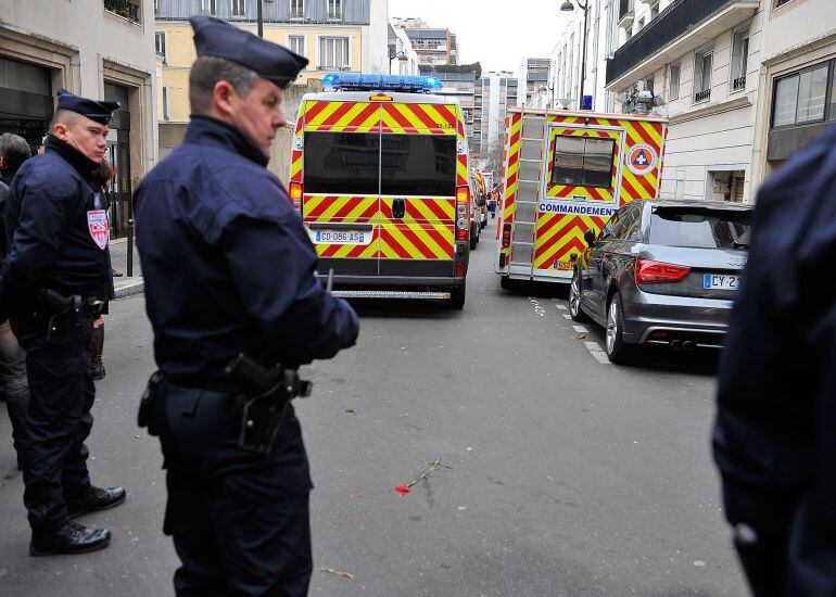 PARIS, FRANCE - JANUARY 07:  Police stand watch at Charlie Hebdo offices after a deadly attack on the french satirical magazine on January 7, 2015 in Paris, France. Twelve people were killed including two police officers as two gunmen opened fire at the m