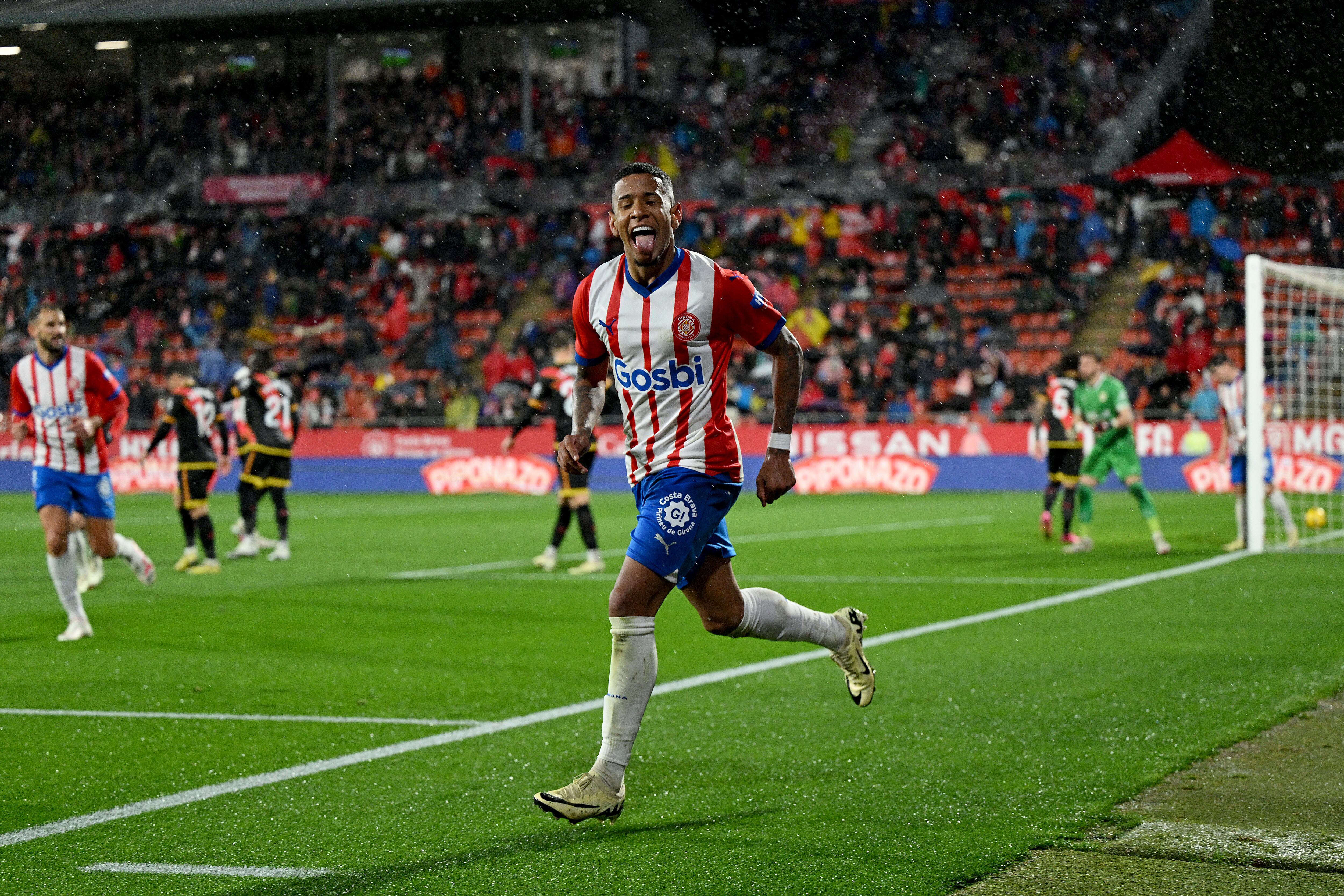 GIRONA, SPAIN - FEBRUARY 26: Savio of Girona celebrates scoring the 3rd team goal during the LaLiga EA Sports match between Girona FC and Rayo Vallecano at Montilivi Stadium on February 26, 2024 in Girona, Spain. (Photo by David Ramos/Getty Images)