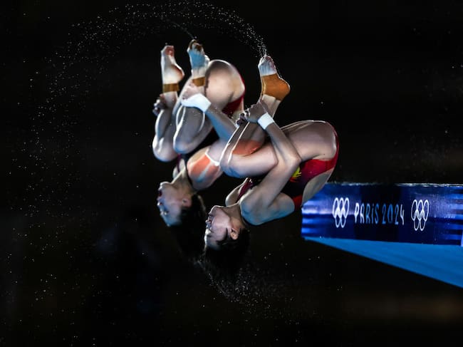 Chen Yuxi y Quan Hongchan, del equipo chino consiguieron el triunfo olímpico en salto desde trampolín en parejas.