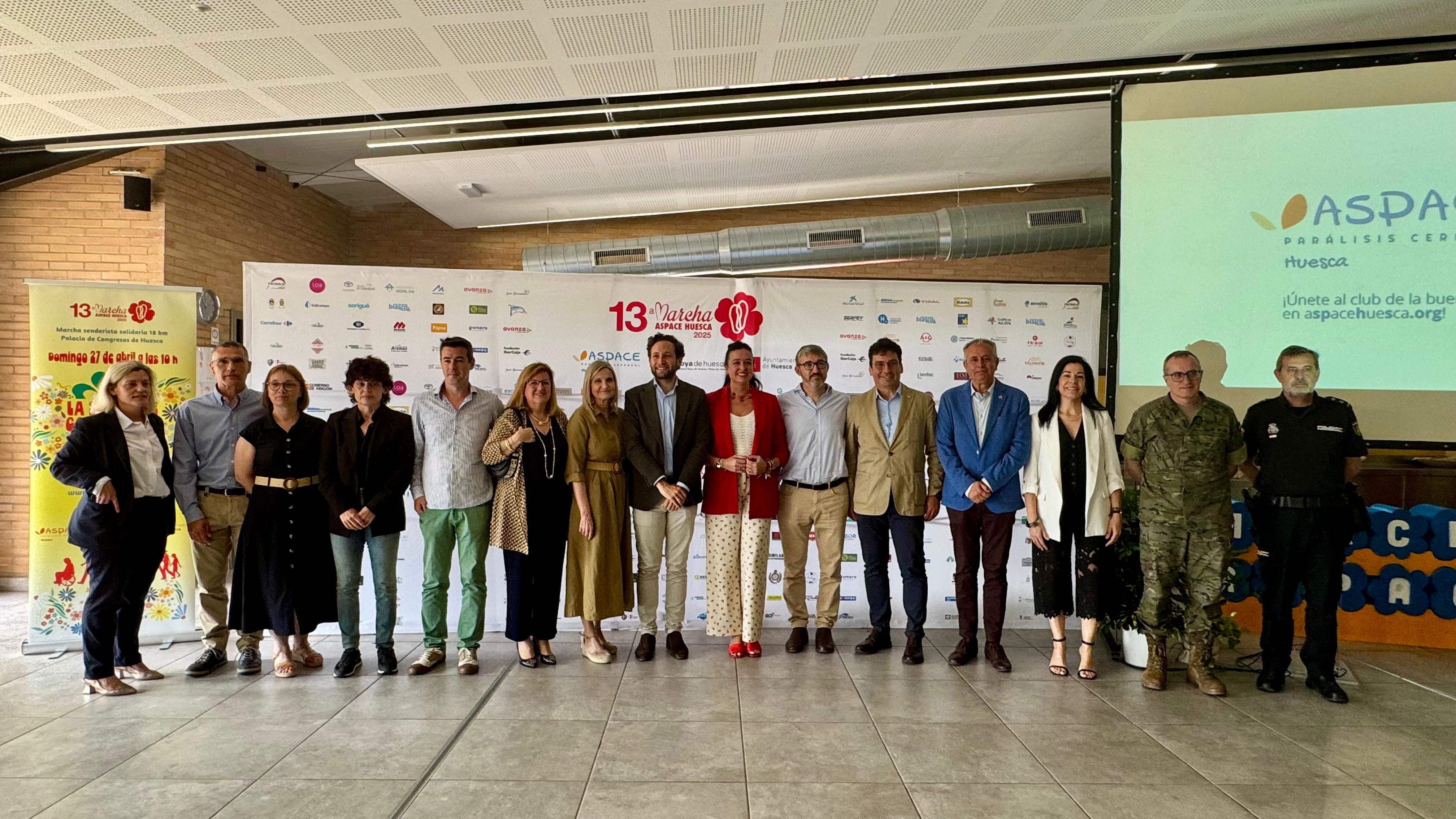 Representantes de Aspace Huesca, instituciones, empresas y voluntarios en el balance de la Marcha Aspace