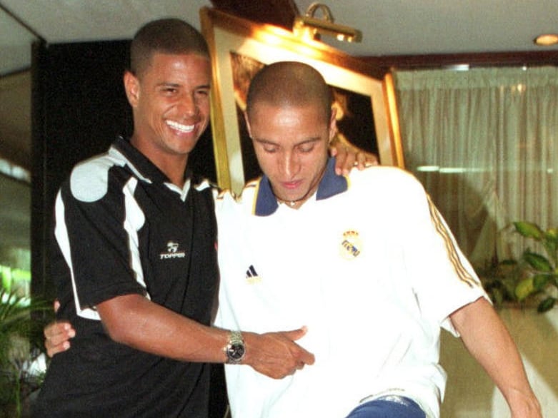 Marcelinho, con Roberto Carlos en una imagen de archivo