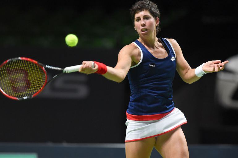 Spain's Carla Suarez Navarro hits a return to Italy's Francesca Schiavone during a quarter final tennis match at the Antwerp Diamond Games WTA tennis tournament on February 13, 2015 in Antwerp. AFP PHOTO / BELGA / LUC CLAESSEN ***Belgium Out***