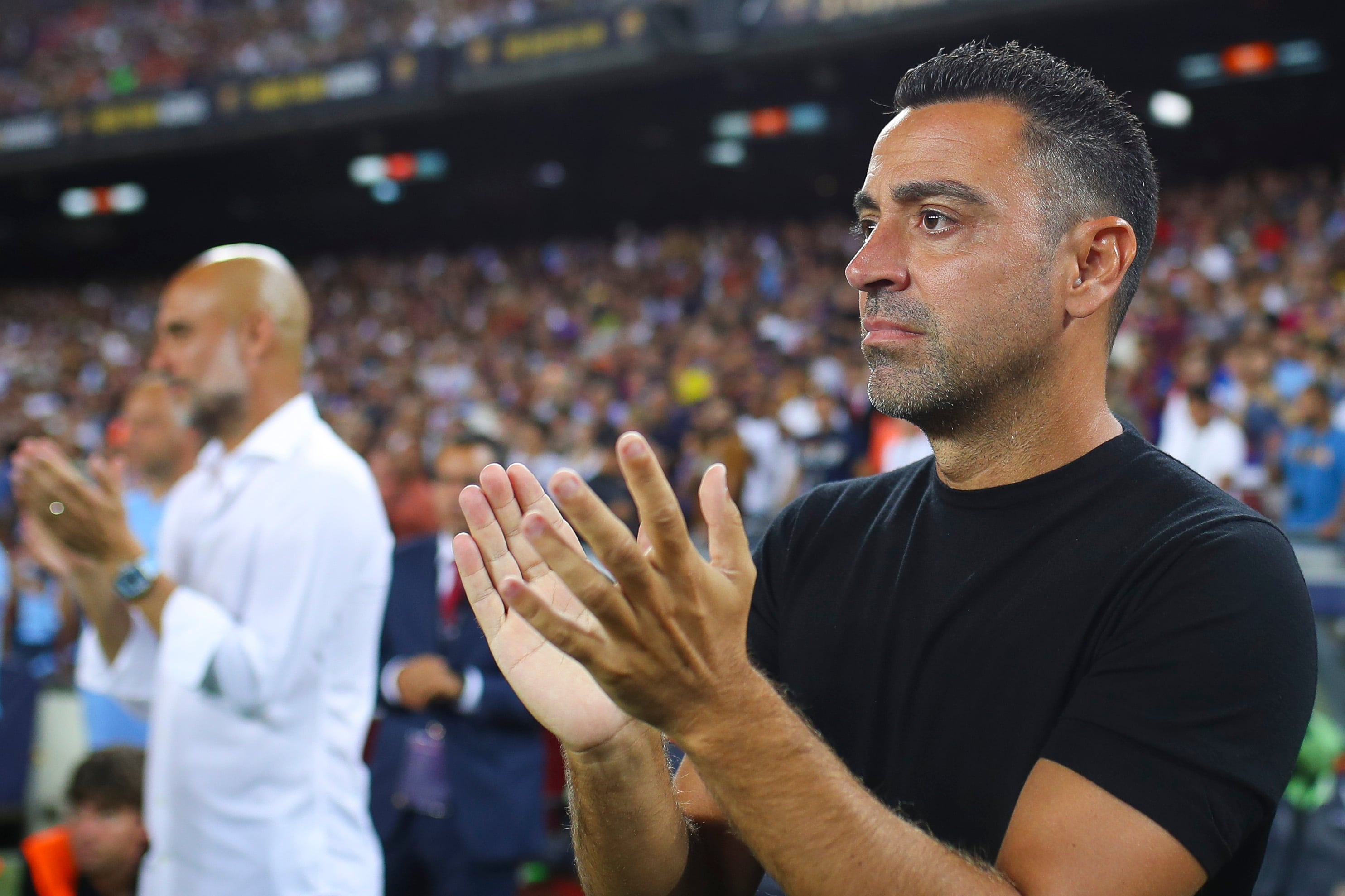 Xavi Hernández y Pep Guardiola, durante su último enfrentamiento en el Camp Nou